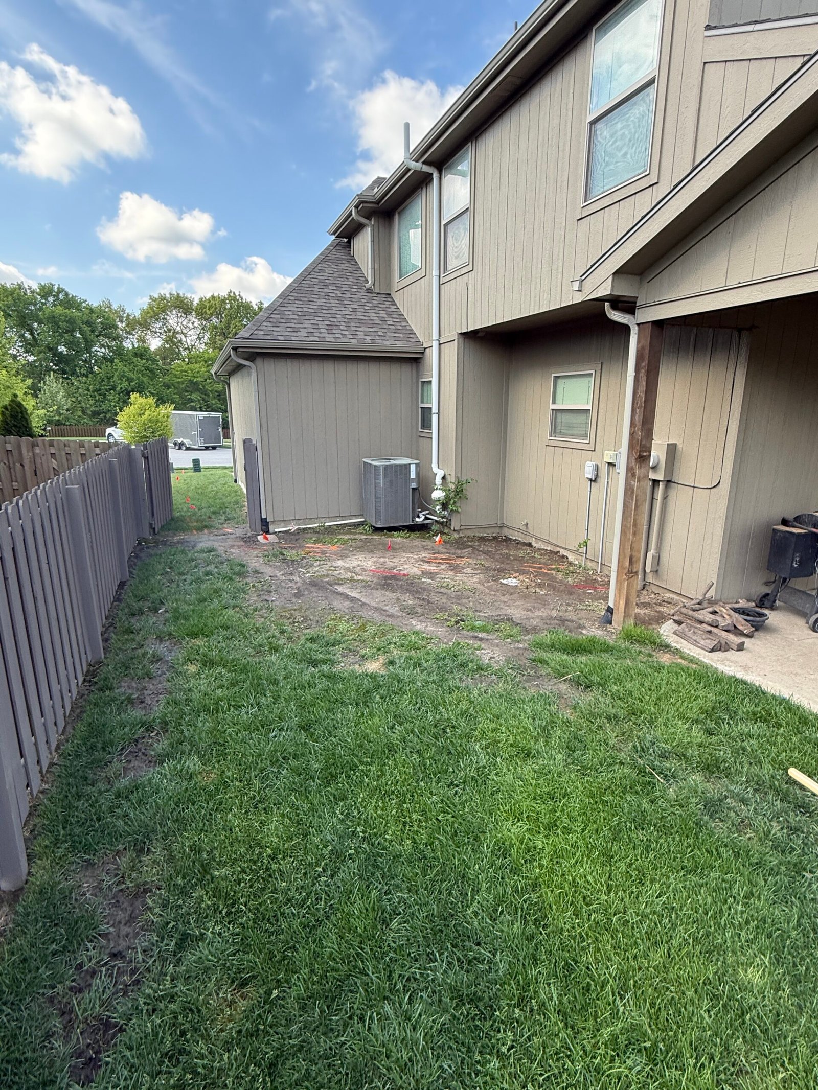 Yard before drainage and rock landscaping project