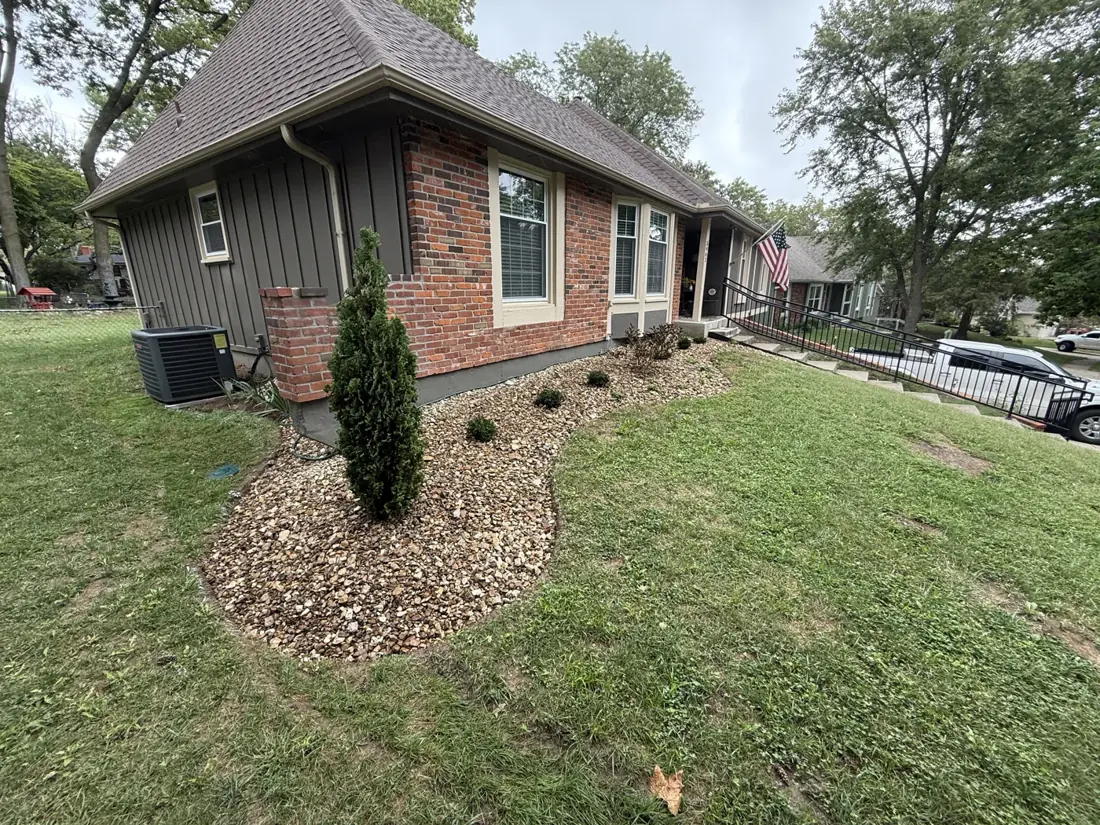 Front landscape bed with decorative rock and shrubs