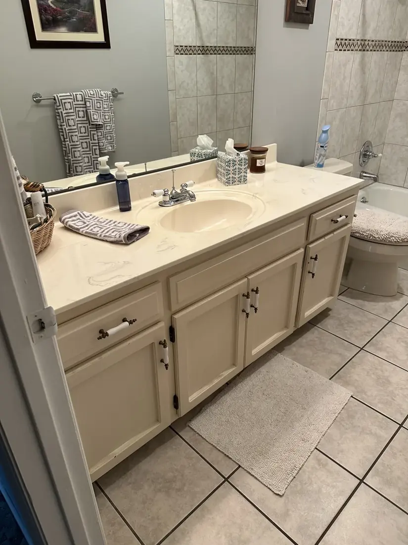 Cream bathroom vanity before cabinet painting